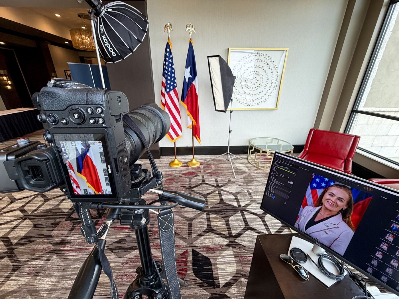 Tethered camera and monitor at a Headshot Station setup — the subject's frame on screen the moment it's shot